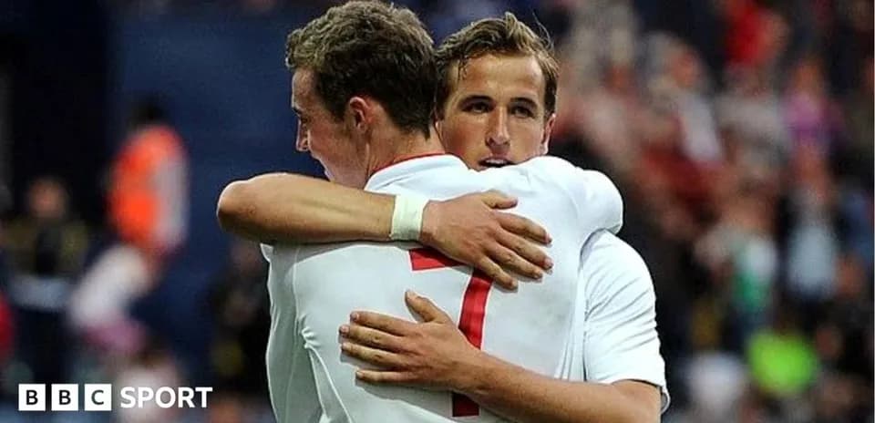 Two players hugging on the field after scoring