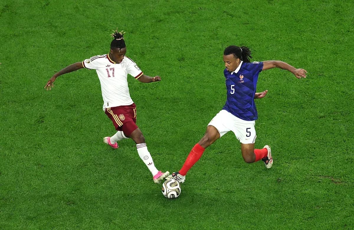 Two players contesting for the ball during match