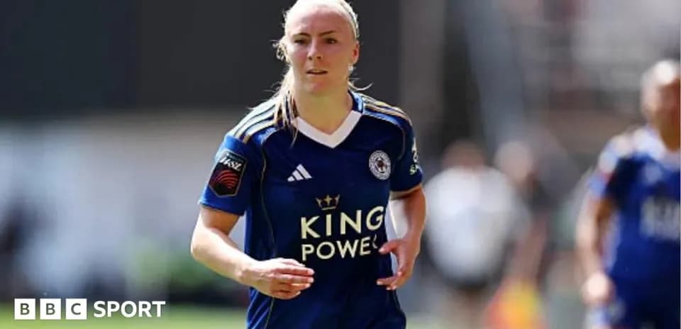 Player running in Leicester City jersey on field