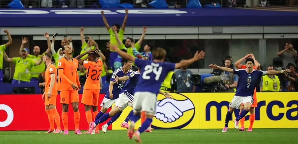 Japan players celebrating goal against Netherlands