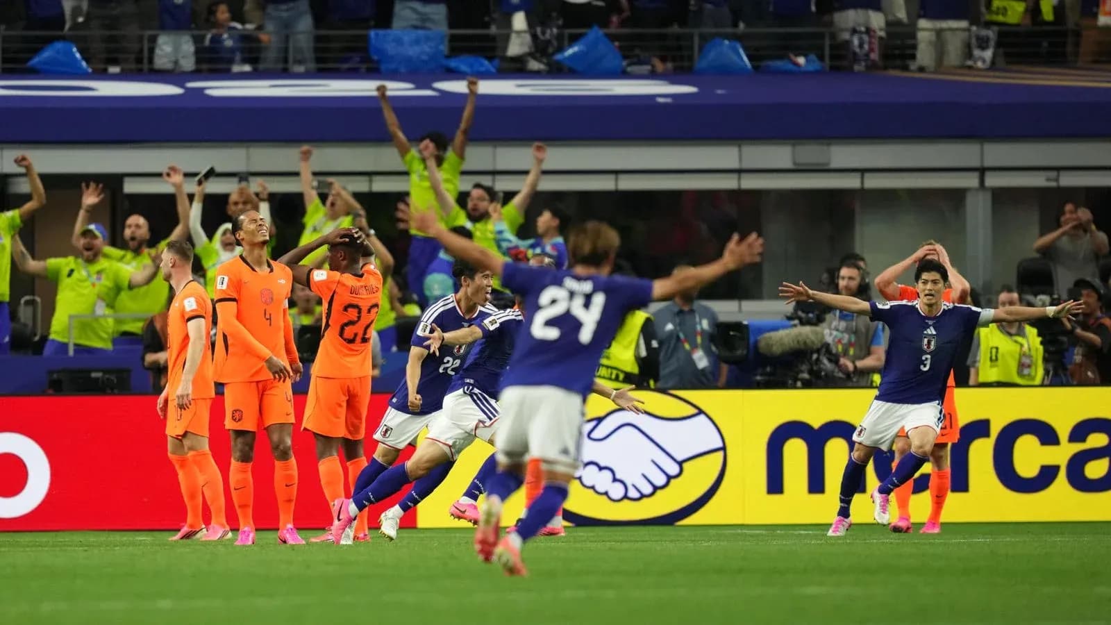 Japan players celebrating goal against Netherlands