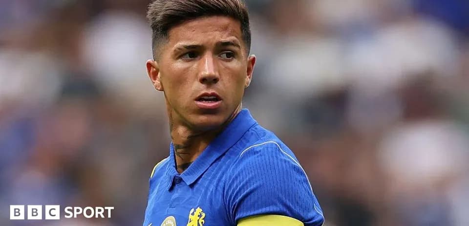Player wearing blue jersey and captain's armband