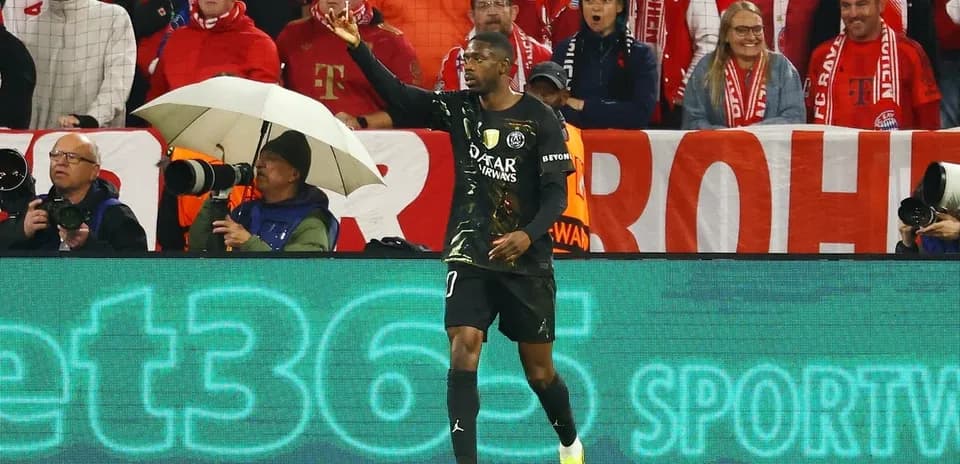 Goalkeeper gesturing to fans during match