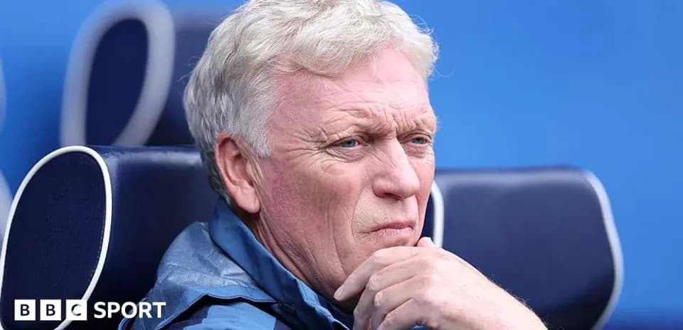 Coach sitting on bench during match observation