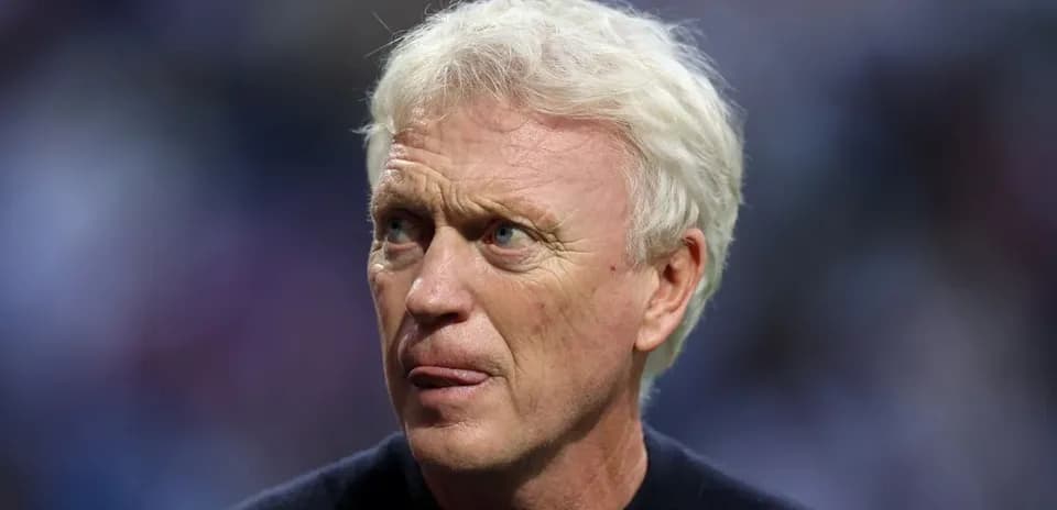 Coach looking thoughtful during match