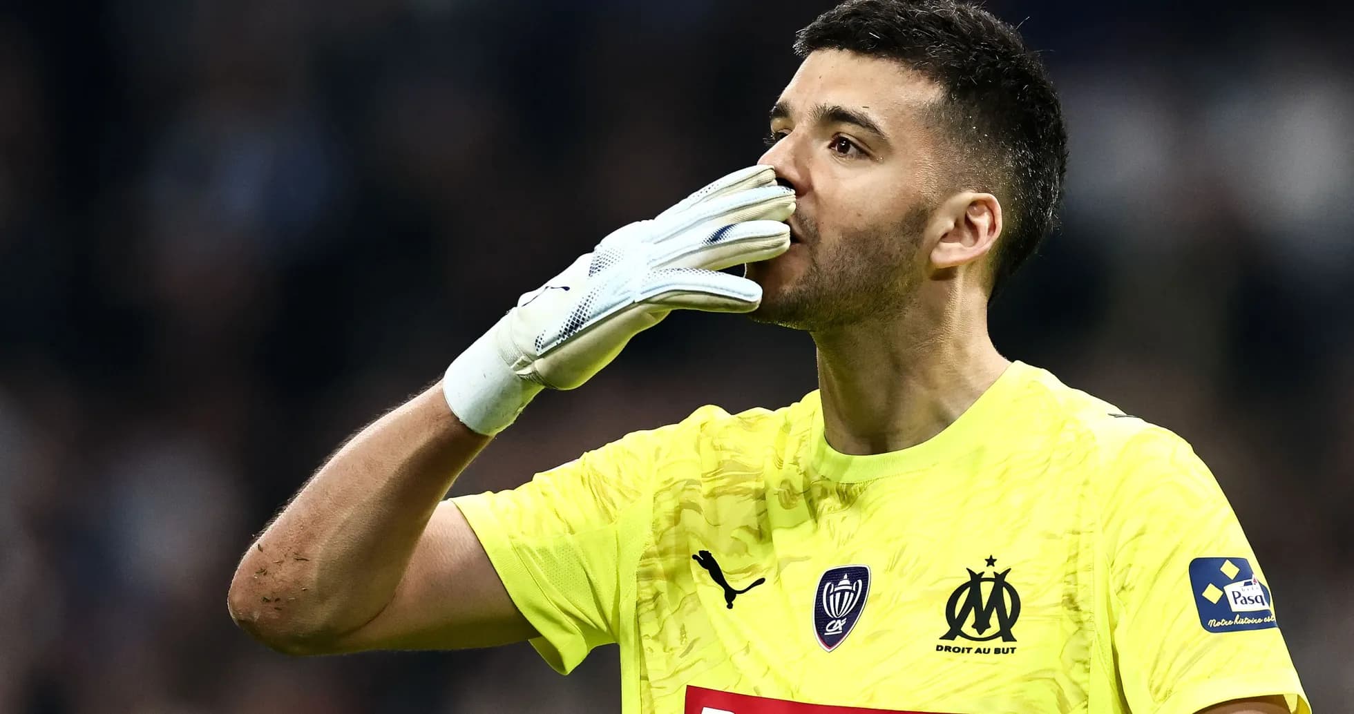 Goalkeeper celebrating with hand gesture during match