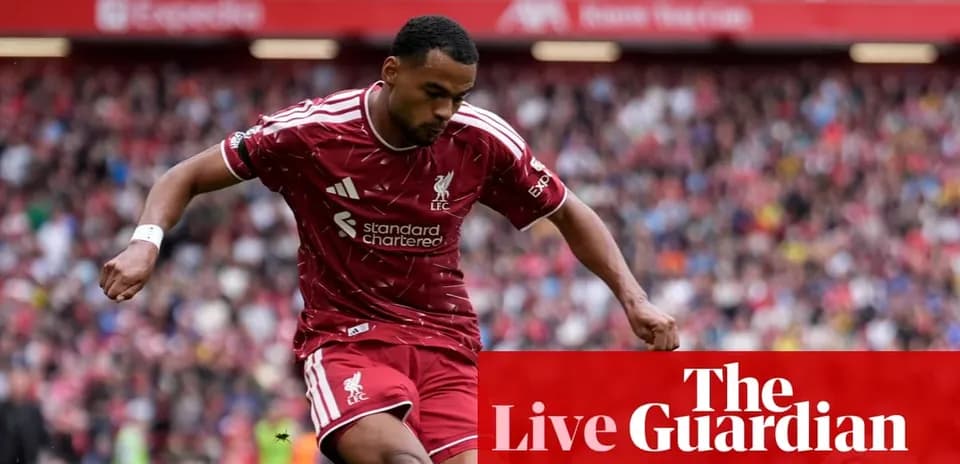 Liverpool player dribbling on the pitch during match