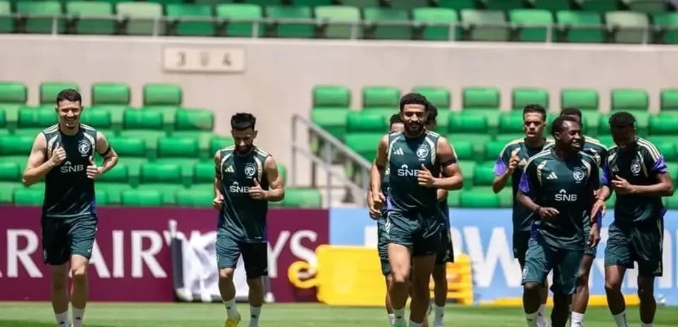 Players jogging during training session on pitch