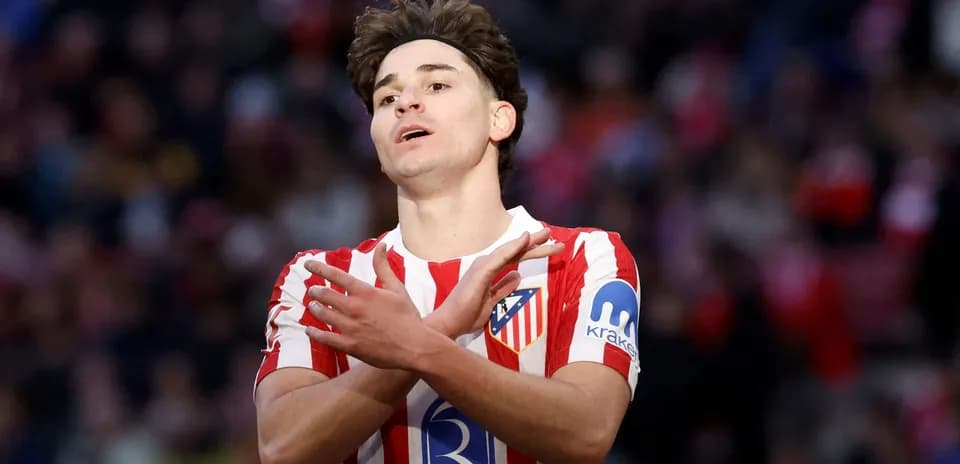 Atletico Madrid player gesturing during match