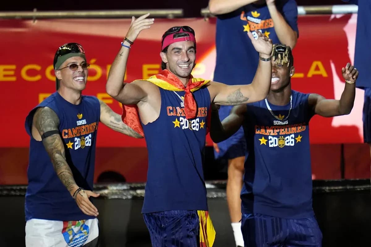 Players celebrating with medals and flags on stage