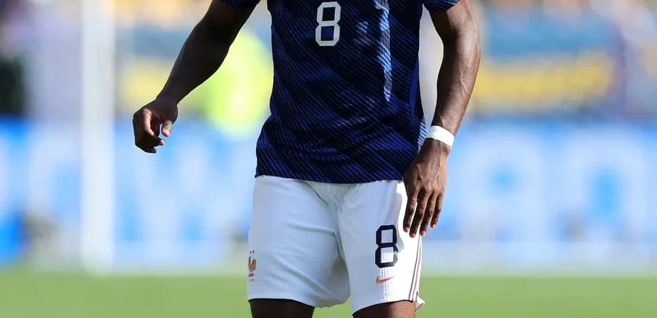 Player in France kit preparing for play on field