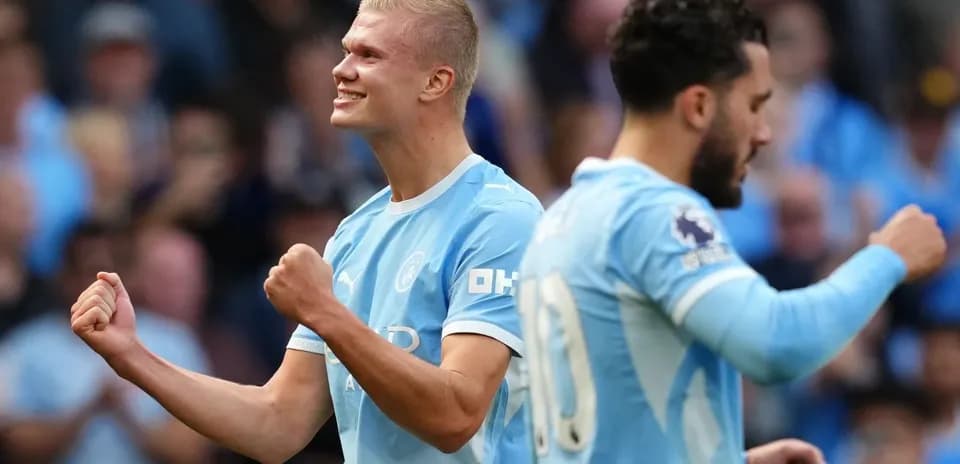 Erling Haaland celebrating goal with teammate during match