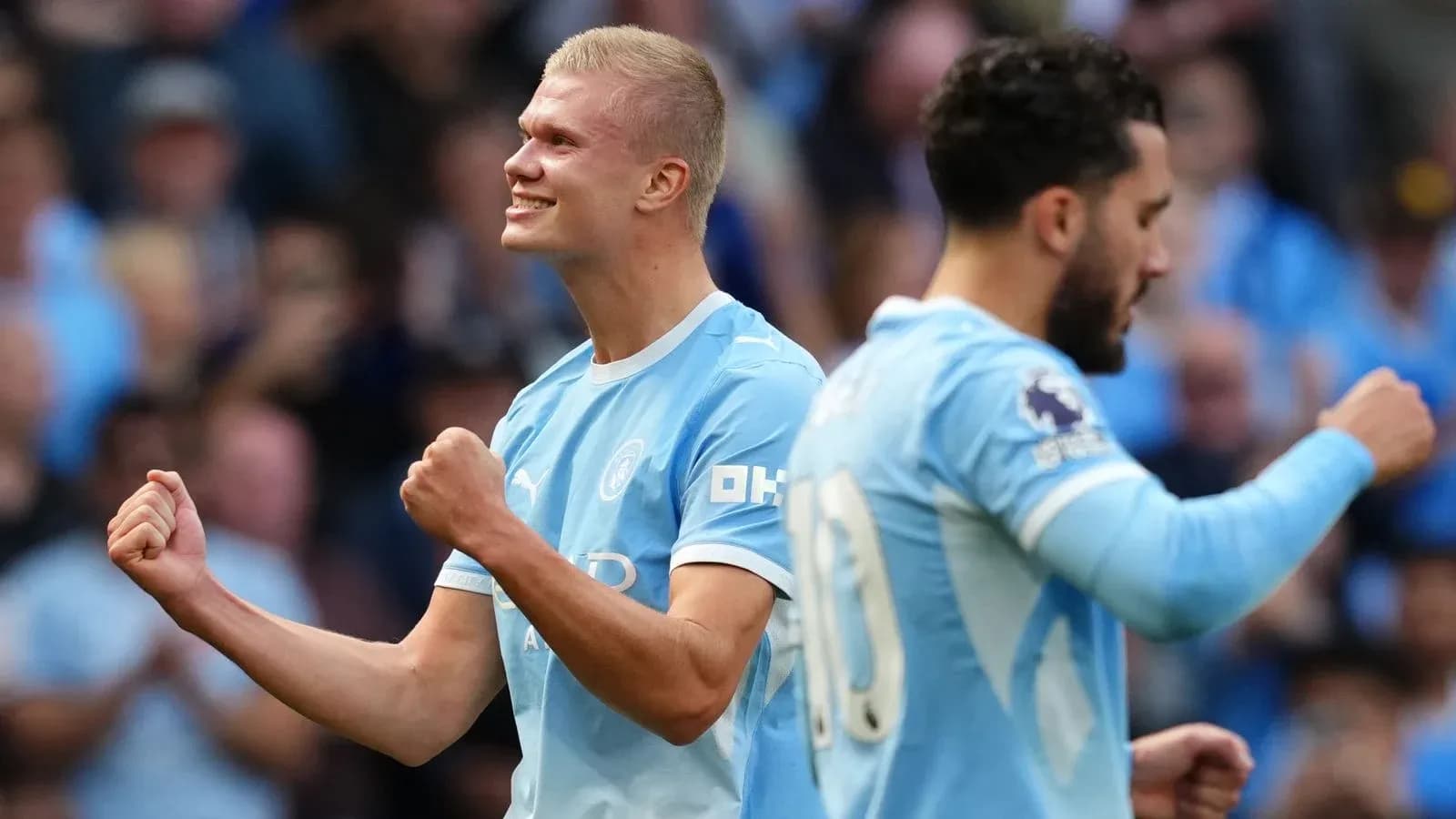 Erling Haaland celebrating goal with teammate during match