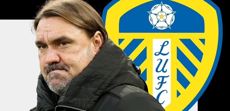 Coach standing in front of Leeds United logo