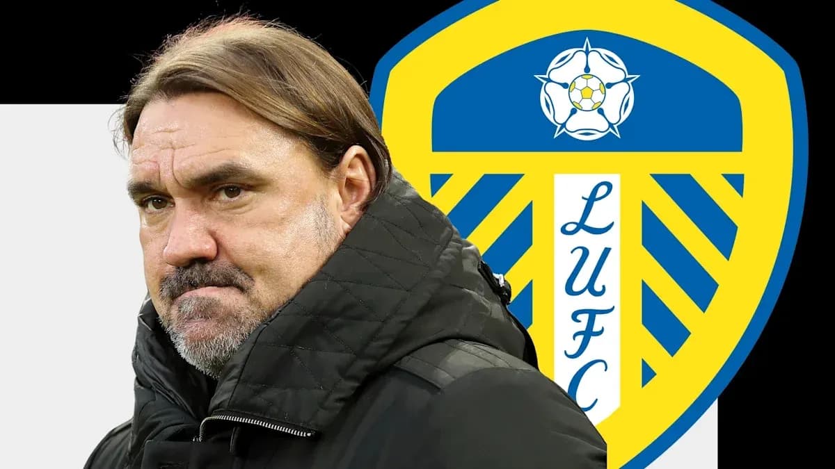 Coach standing in front of Leeds United logo