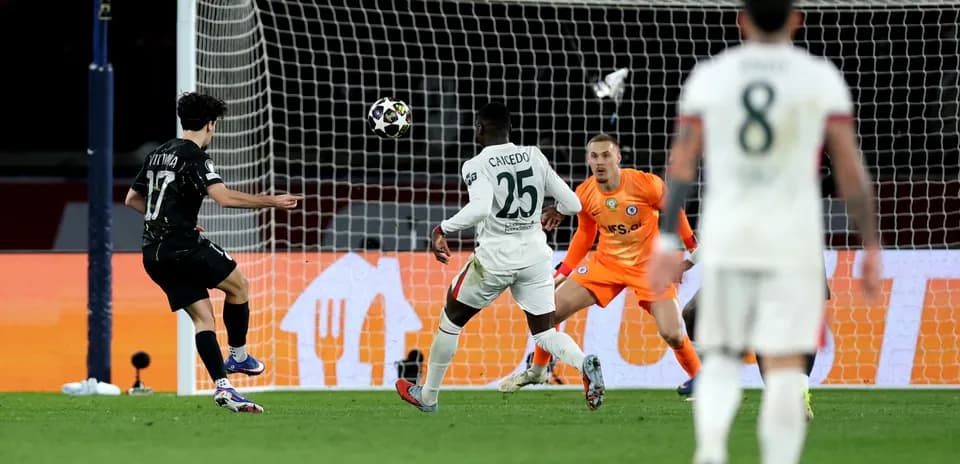 Player shooting on goal during Champions League match