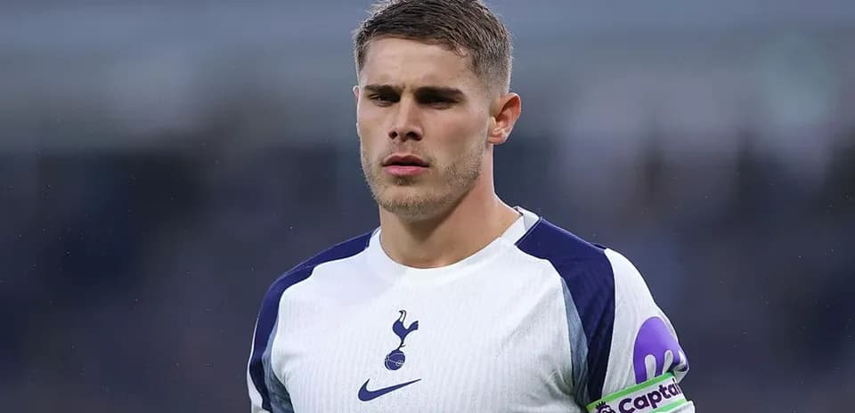 Player in Tottenham jersey with captain's armband