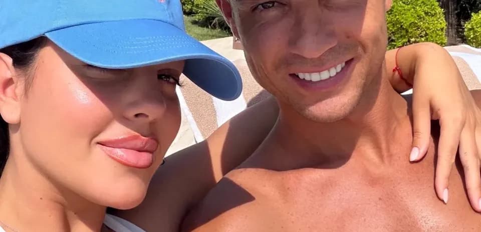 Couple posing for a selfie by the pool