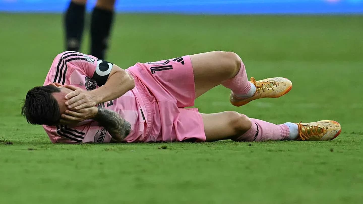 Player lying on the field, holding face in pain
