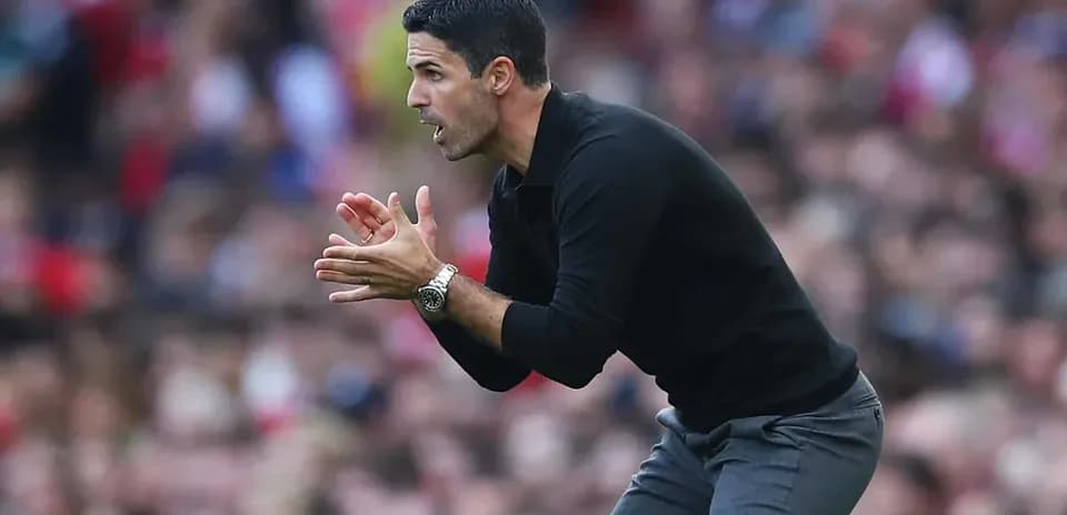 Coach gesturing from the sidelines during match