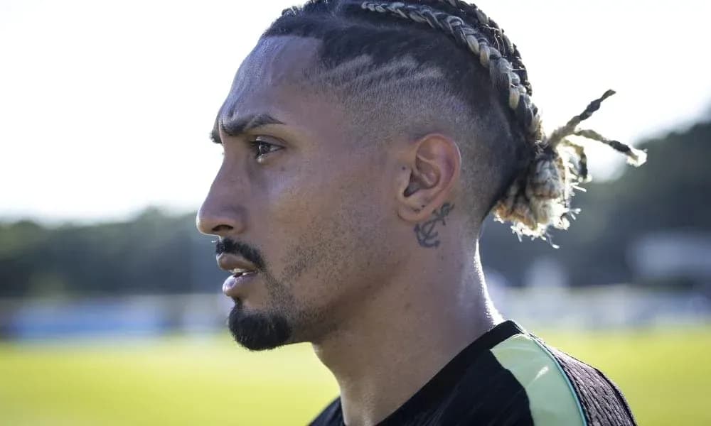 Profile of player with braided hairstyle outdoors