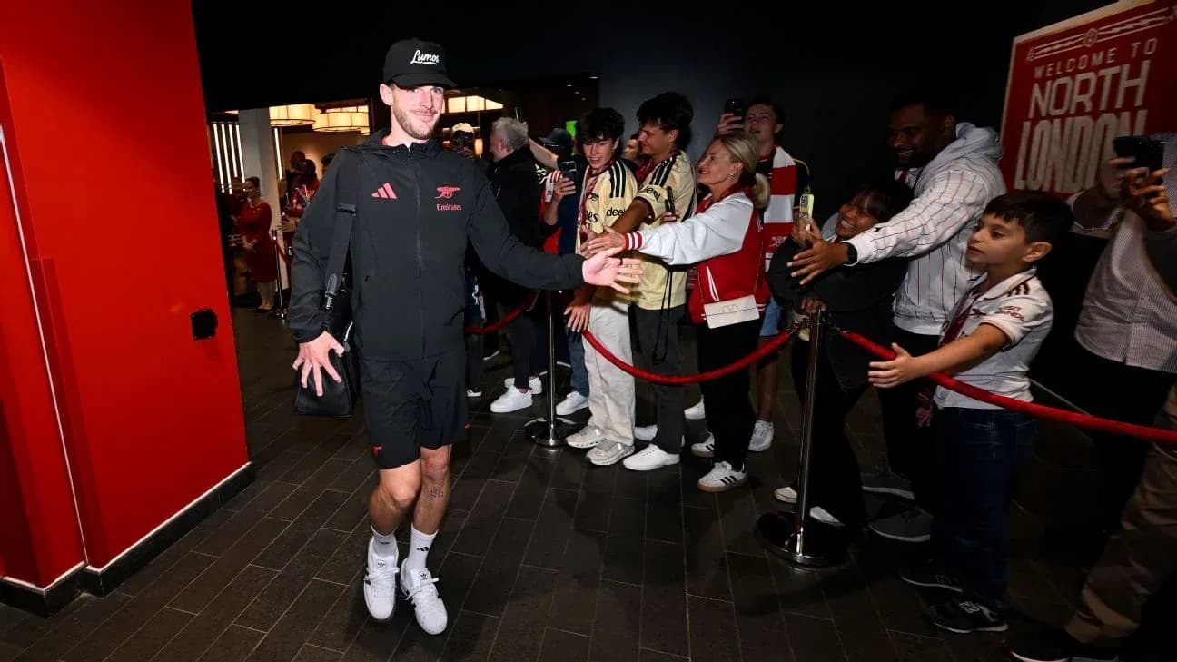 Player greeting fans outside the stadium entrance
