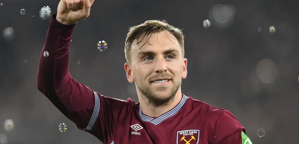 Player celebrating with raised fist and smile