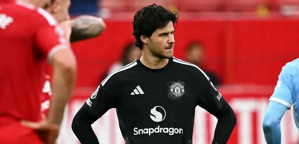 Goalkeeper in black jersey during match moment