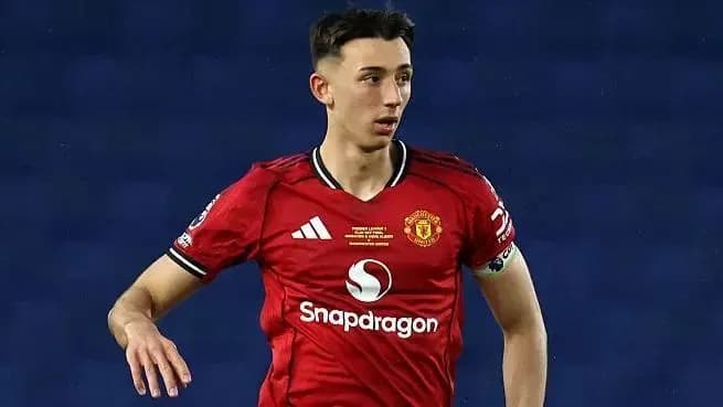 Player in red Manchester United kit on the field