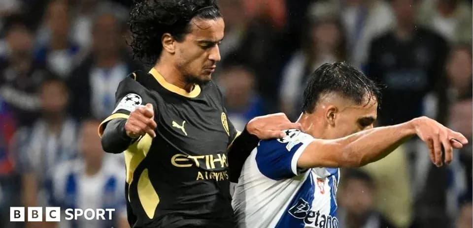 Two players challenging for the ball during match