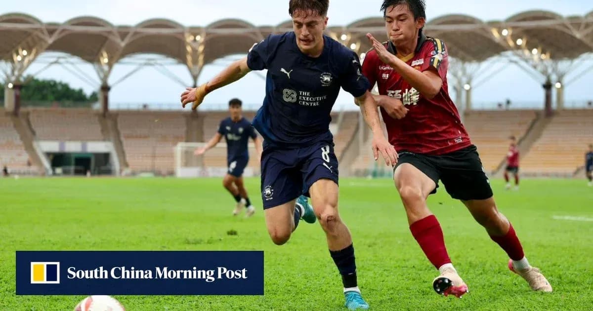 Player in blue shirt evading opponent in red shirt