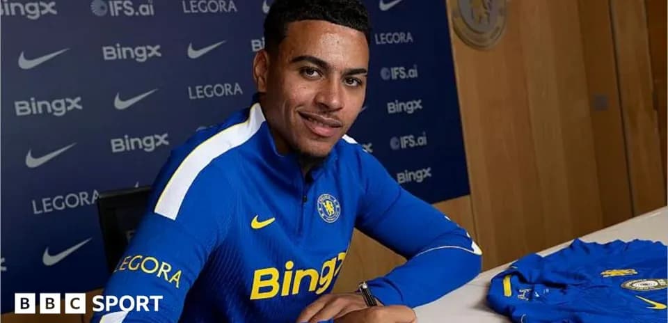 Player signing contract at club announcement event