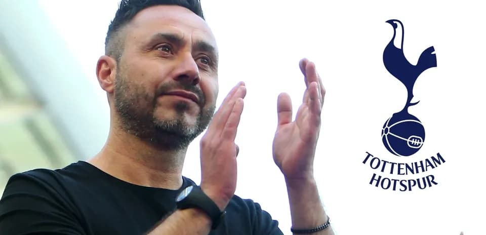 Man applauding with Tottenham Hotspur logo in background