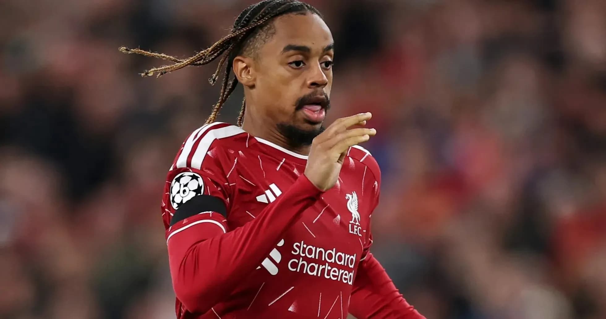 Player in Liverpool kit running during match