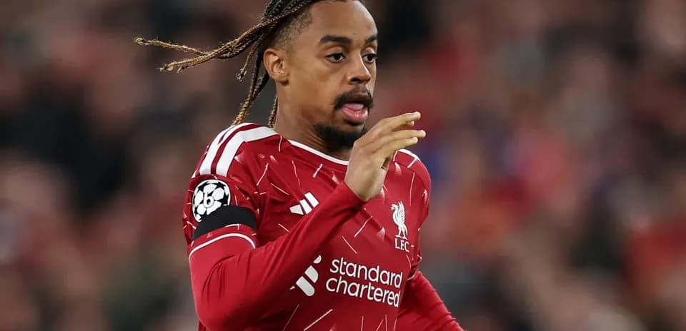 Player in Liverpool kit running during match