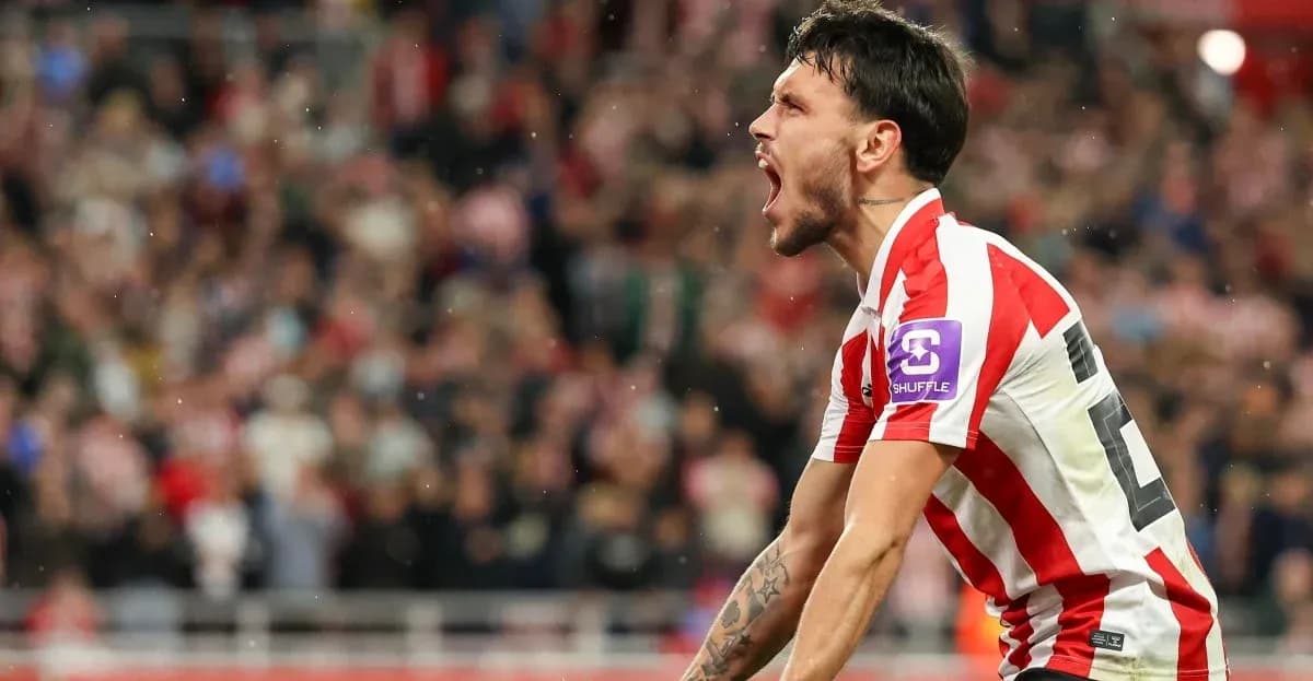 Player celebrating passionately in front of crowd