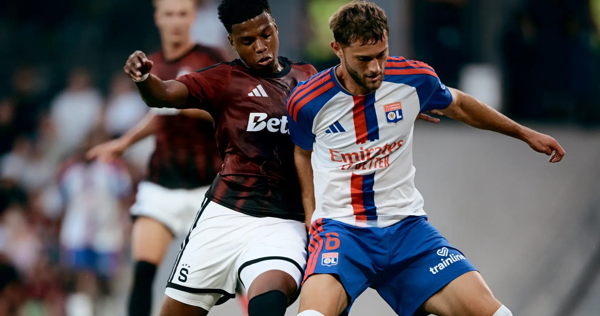 Players contesting the ball during Lyon match