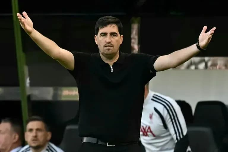 Coach gesturing from the sidelines during match