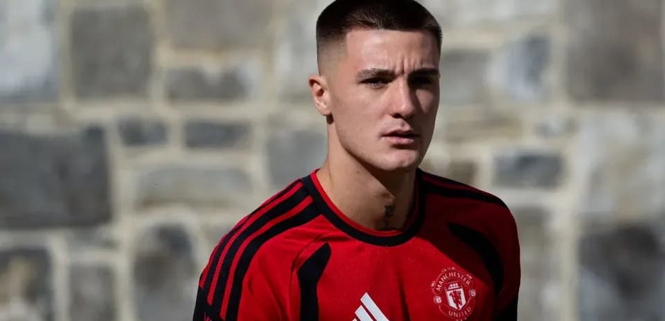 Player in Manchester United training kit outdoors