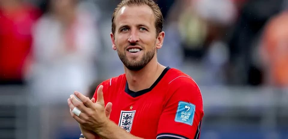 Player in red jersey applauding to the crowd