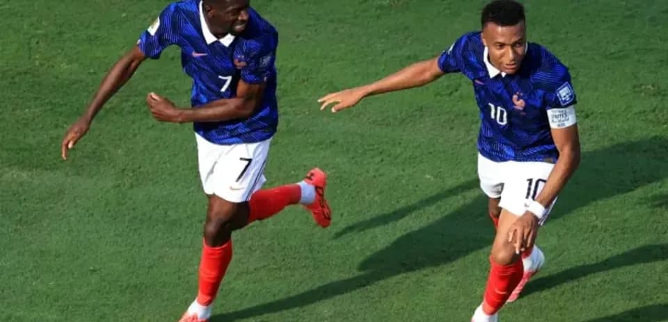 Two players celebrating after scoring a goal