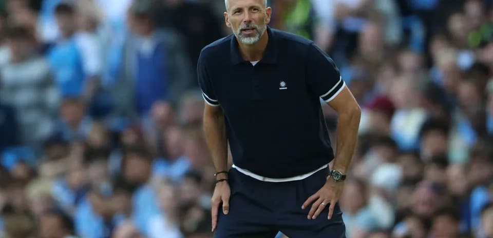 Coach observing the match from the sidelines