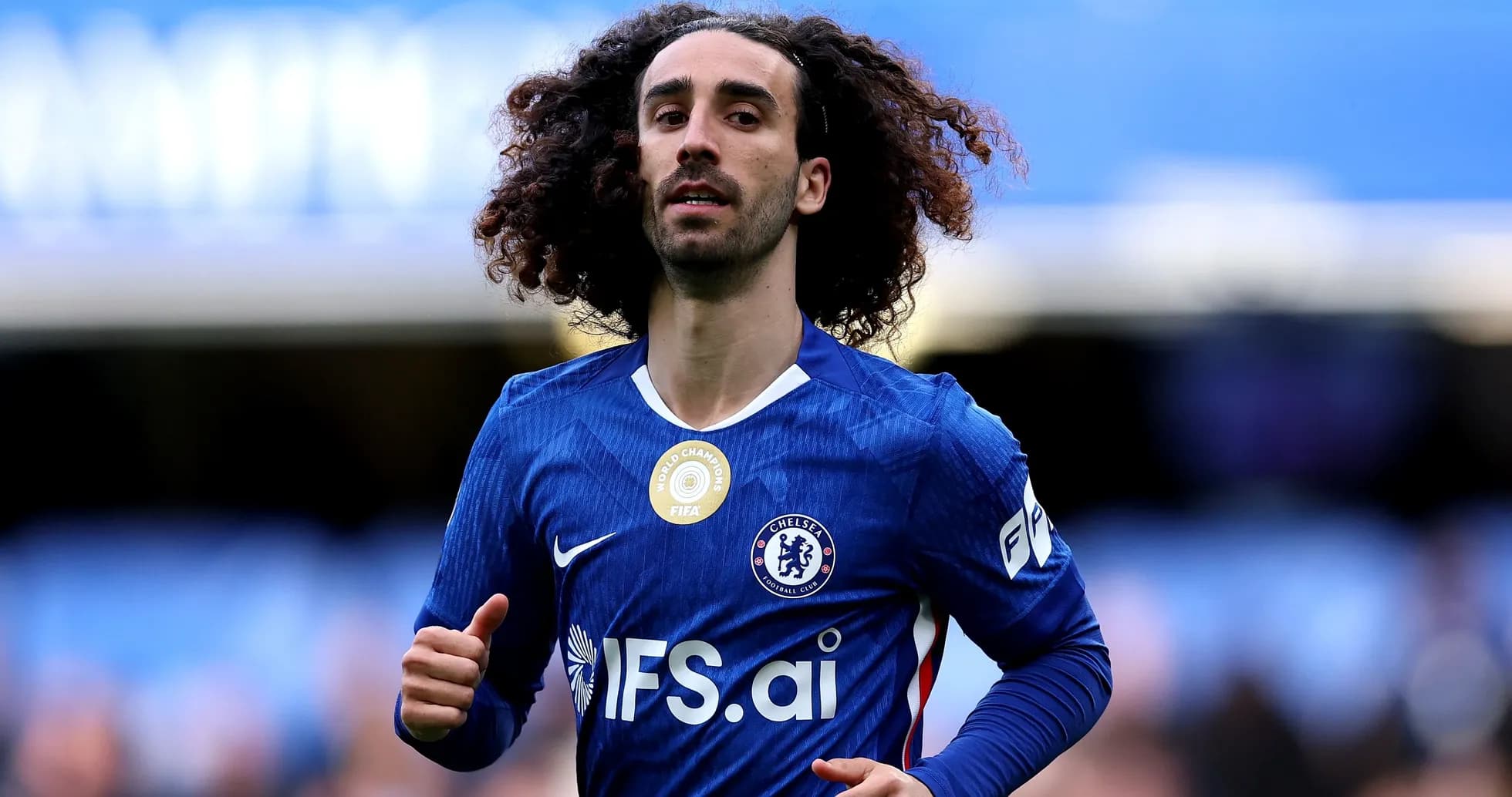 Player running in Chelsea kit during match