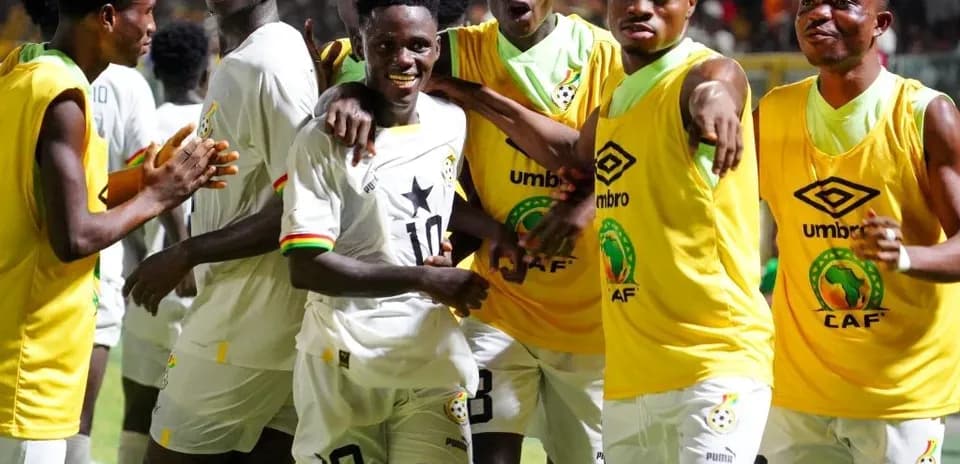 Players celebrating together in team jerseys