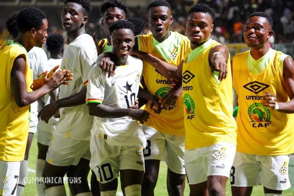 Players celebrating together in team jerseys