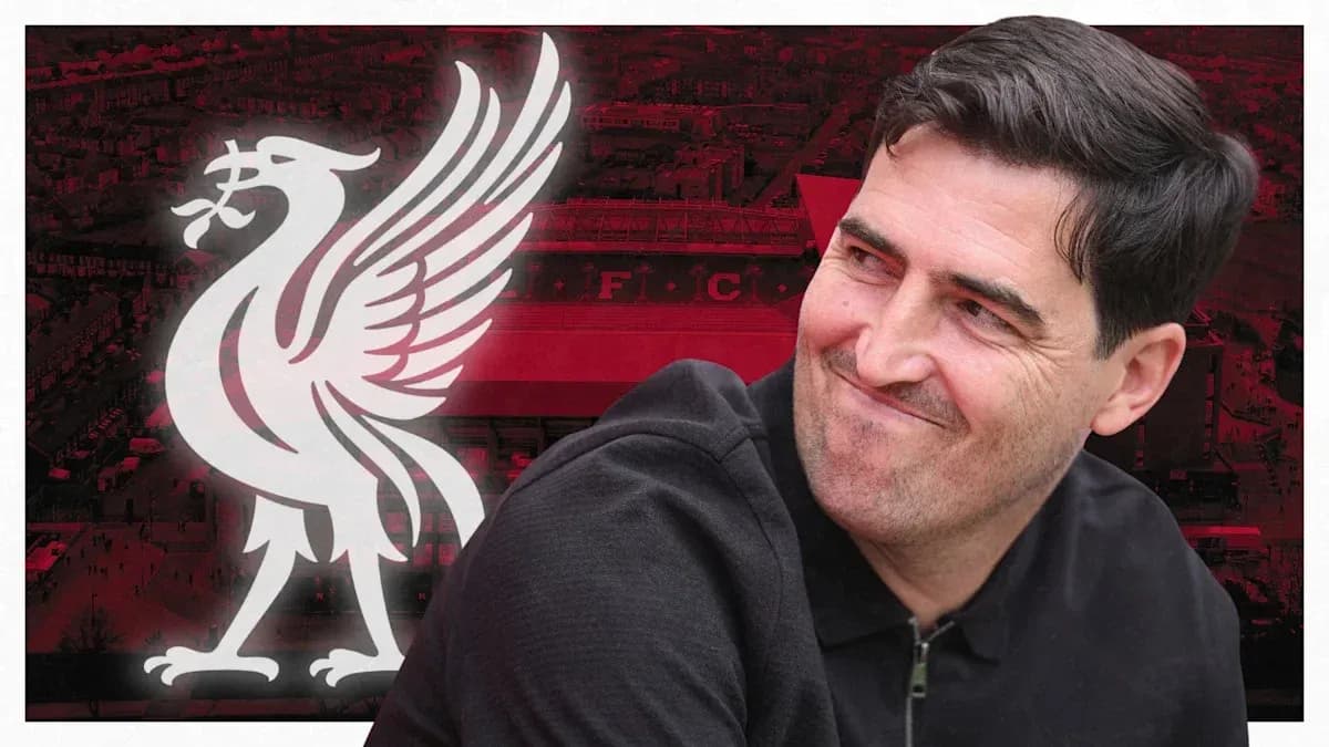 Man smiling with Liverpool FC logo in background