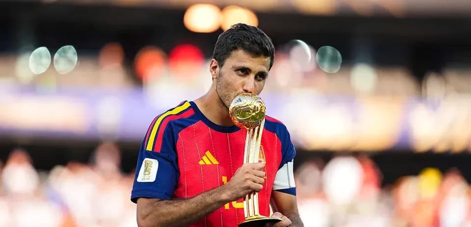 Player holding World Cup trophy after victory