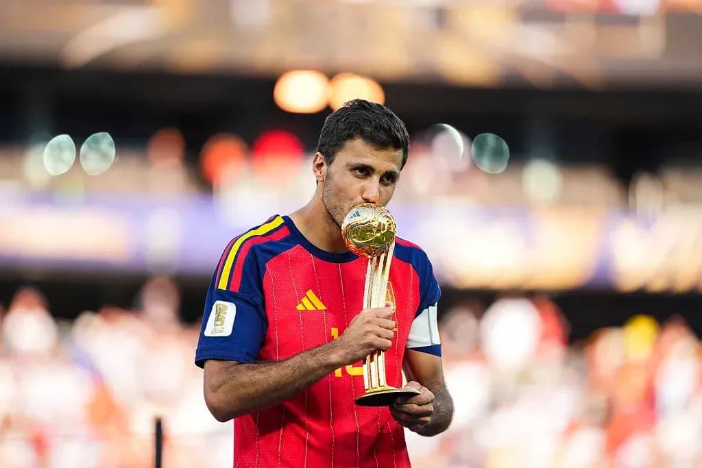 Player holding World Cup trophy after victory
