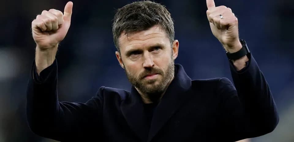 Coach giving thumbs up gesture after match