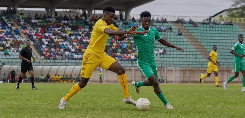 Players contesting for the ball in football match